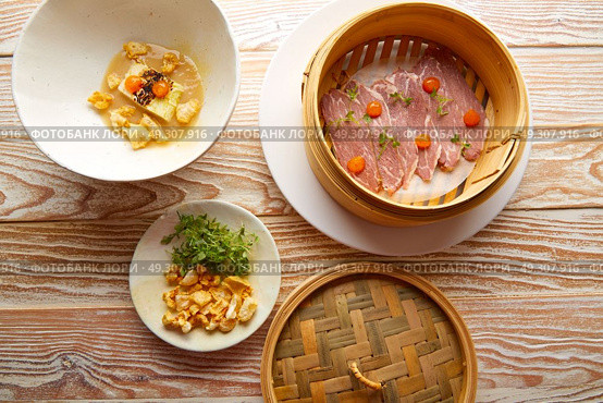 Iberian pork ham with XO sauce and cabbage stew with pork rinds. Стоковое фото, агентство Ingram Publishing / Фотобанк Лори