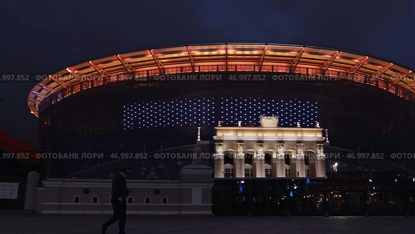 Illuminated night city with sports arena and street. Стоковое фото, фотограф David Kashakhi / Фотобанк Лори