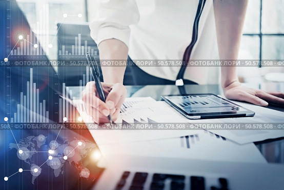Image female hand touching modern tablet.Investment manager working new private banking project office.Using electronic device. Graphic icons, worldwide stock exchanges interface on screen. . Image woman signs document, modern tablet table.Investment manager working private banking project office.Use electronic device. Graphic icons,worldwide stock exchanges interface on screen. Horizontal. Стоковое фото, агентство Ingram Publishing / Фотобанк Лори