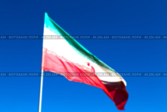 in iran blur  iranian waving flag  the blue sky and wind. Стоковое фото, агентство Ingram Publishing / Фотобанк Лори