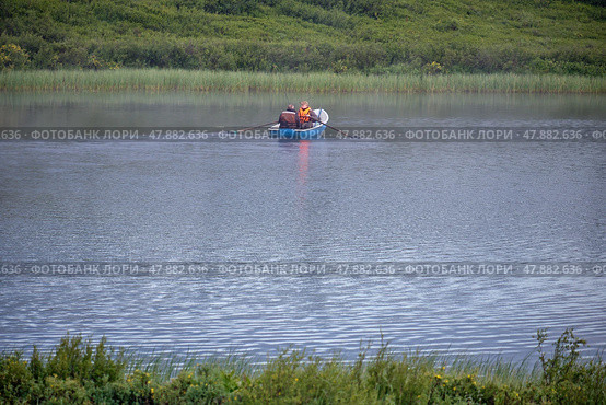 ishermen floats on the lake in the boat and fishing. Morning with fog over water. (2023 год). Редакционное фото, фотограф Сергей Пристяжнюк (Serg Zastavkin) / Фотобанк Лори