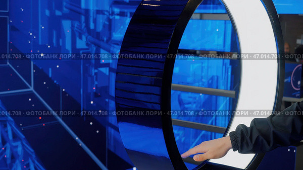 IT specialist standing In front of modern computer and activating data center with gestures. Стоковая иллюстрация, иллюстратор David Kashakhi / Фотобанк Лори