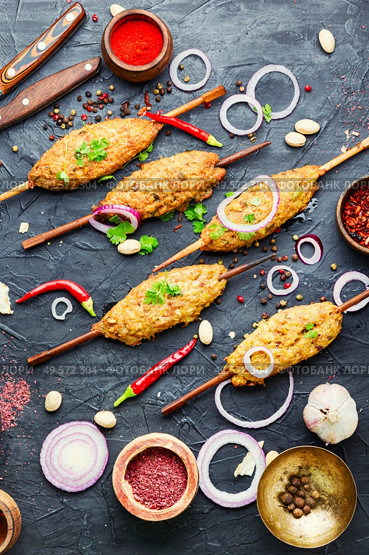 Juicy lula kebab made from meat.Minced meat on the grill. Lula kebab on stick. Стоковое фото, агентство Ingram Publishing / Фотобанк Лори