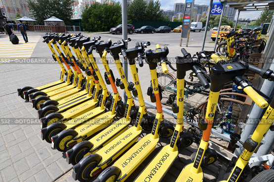 Krasnogorsk, Russia - July 12. 2022 Short-term rental service for electric scooters Yandex Go. Редакционное фото, фотограф Володина Ольга / Фотобанк Лори