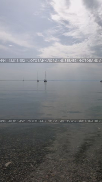 Крым, Евпатория, курорт, Чёрное море, штиль, яхты на рейде, облака, морская вода. Стоковое видео, видеограф Андрей Макаренко / Фотобанк Лори