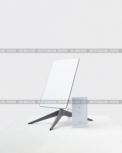 KYIV, UKRAINE - JANUARY 24, 2023: Starlink antenna and wi-fi router on white background. Редакционное фото, агентство Ingram Publishing / Фотобанк Лори