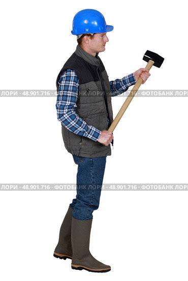 Labourer holding a mallet. Стоковое фото, агентство Ingram Publishing / Фотобанк Лори