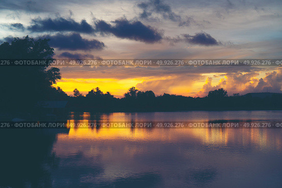 landscape sunset over the tropical lake in Thailand. Стоковое фото, агентство Ingram Publishing / Фотобанк Лори