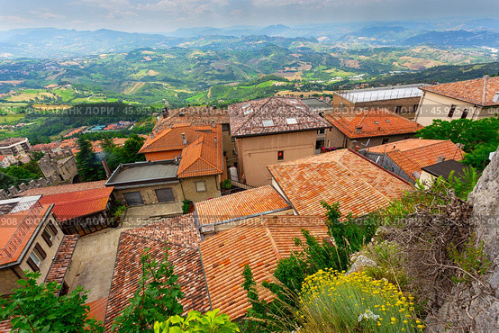 Landscape with roofs of houses in small tuscan town in province (2014 год). Стоковое фото, фотограф Олег Жуков / Фотобанк Лори