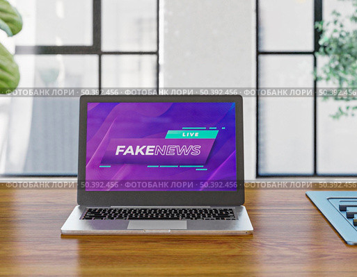 laptop desk with fake news. Стоковое фото, агентство Ingram Publishing / Фотобанк Лори