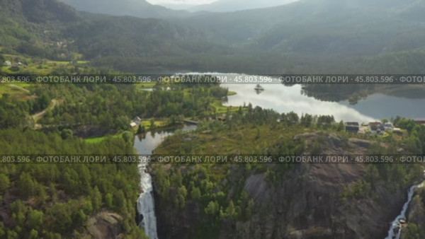 Latefossen is one of the most visited waterfalls in Norway and is located near Skare and Odda in the region Hordaland, Norway. Consists of two separate streams flowing down from the lake Lotevatnet. (2019 год). Стоковое видео, видеограф Андрей Армягов / Фотобанк Лори