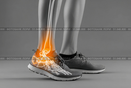 Leg with ankle joint pain icon. Foot wearing running shoes showing the bones in the ankle area. Grey floor. Feet with red effect of painful injury problems. Legs with anatomical detail glowing orange. Стоковое AI-изображение, AI-художник Марина Демидюк / Фотобанк Лори