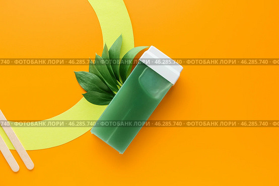 Liposoluble wax cartridge on color background. Стоковое фото, фотограф Pixel_shot / Фотобанк Лори