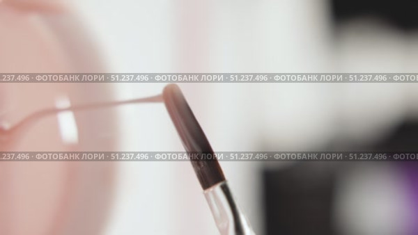 Macro Shot of Nail Technician Collecting Gel Polish from Jar. Стоковое видео, видеограф Скоробогатова Е. / Фотобанк Лори