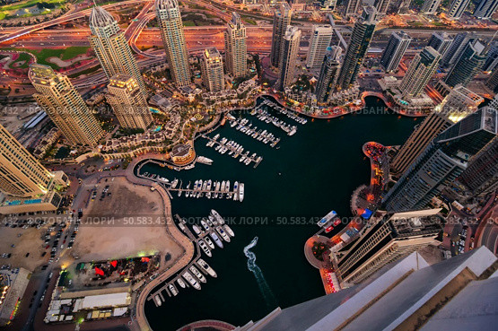 Majestic colorful dubai marina skyline during night. Multiple tallest skyscrapers of the world. Dubai marina, United Arab Emirates. Стоковое фото, агентство Ingram Publishing / Фотобанк Лори