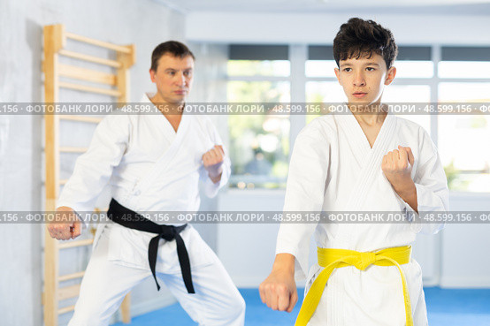Man and boy teenager train karate technique. Стоковое фото, фотограф Яков Филимонов / Фотобанк Лори