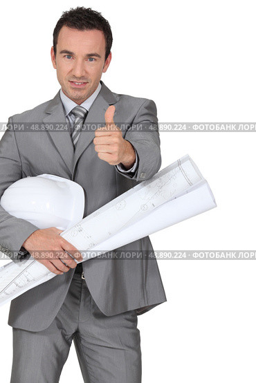 Man dressed in suite holding hard hat and blue-prints. Стоковое фото, агентство Ingram Publishing / Фотобанк Лори