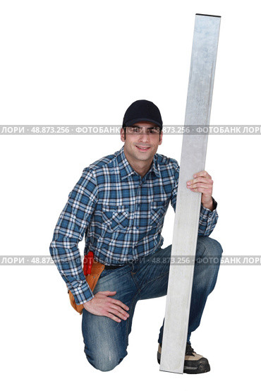 Man holding sheet of metal. Стоковое фото, агентство Ingram Publishing / Фотобанк Лори