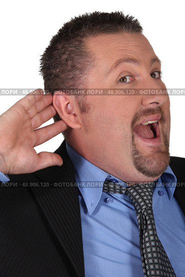 Man pricking up his ears. Стоковое фото, агентство Ingram Publishing / Фотобанк Лори