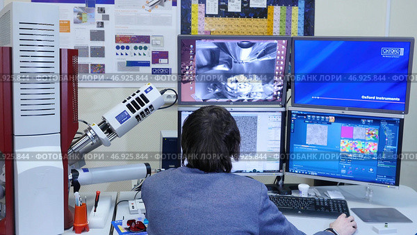 Man sits at the computer and mining bitcoins or another crypto currency. Стоковое фото, фотограф David Kashakhi / Фотобанк Лори