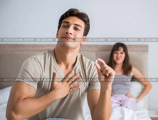 Man suffering from impotency with pill. Стоковое фото, фотограф Elnur / Фотобанк Лори