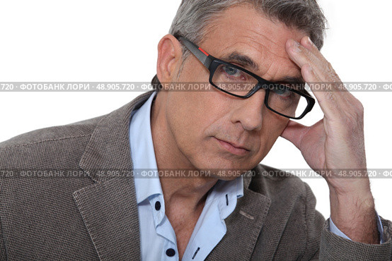 Man with headache. Стоковое фото, агентство Ingram Publishing / Фотобанк Лори