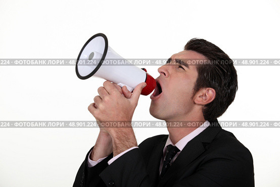Man yelling into a megaphone. Стоковое фото, агентство Ingram Publishing / Фотобанк Лори