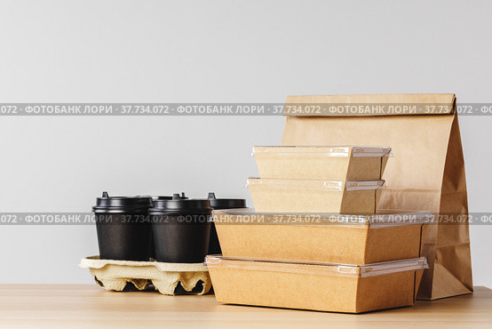 Many various take-out food containers, pizza box, coffee cups and paper bags on light grey background. Стоковое фото, фотограф Сергей Толмачёв / Фотобанк Лори