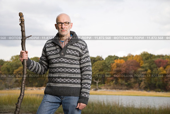 Mature man holding a stick. Стоковое фото, фотограф Shannon Fagan / PantherMedia / Фотобанк Лори