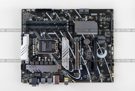 Maykop, Russia - February 18, 2025: New Asus Prime B - 760 plus D4 motherboard on a light gray background top view. Редакционное фото, фотограф Андрей С / Фотобанк Лори