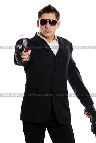 Men in black suit holding gun. Стоковое фото, фотограф Андрей Аркуша / Фотобанк Лори