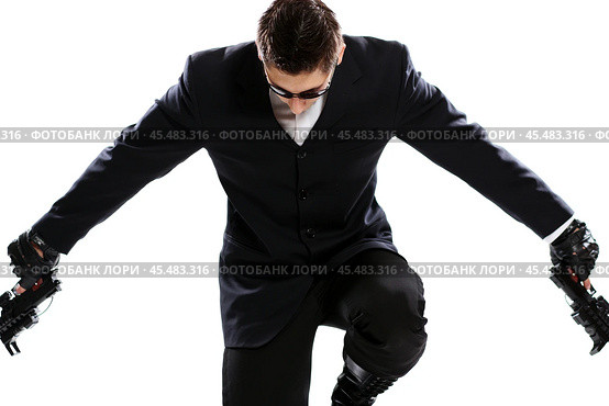 Men in black suit holding gun. Стоковое фото, фотограф Андрей Аркуша / Фотобанк Лори