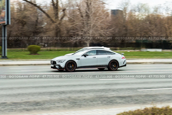 Mercedes GT 63 S AMG V8 BiTurbo car in motion. Mercedes AMG at high speed with blurred urban background. Редакционное фото, фотограф Константин Григорьев / Фотобанк Лори