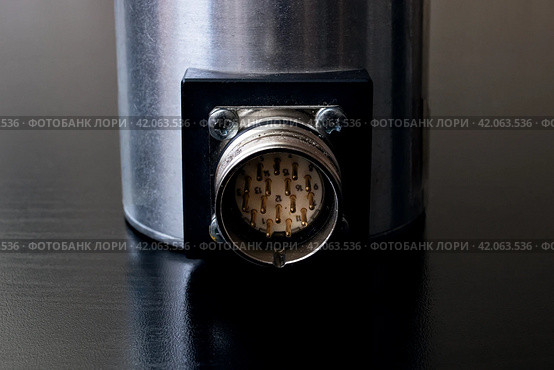 Metal encoder on a black wooden table. Стоковое фото, фотограф Аксенова Вера / Фотобанк Лори