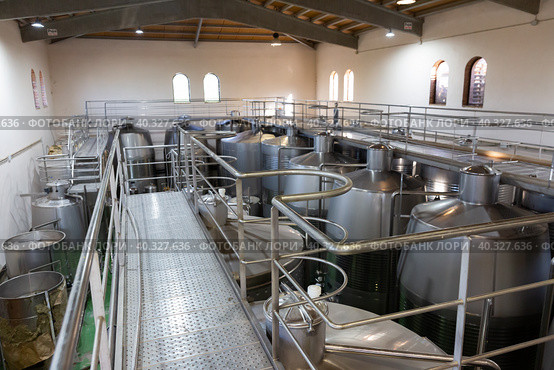 Metallic cisterns for processing and fermentating wine in shop. Стоковое фото, фотограф Яков Филимонов / Фотобанк Лори