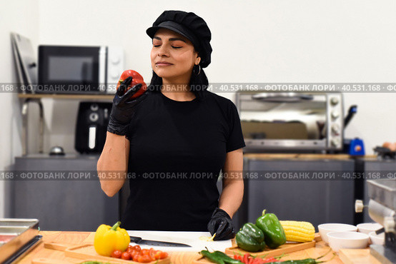 Mexican woman laughing during cooking tacos in the kitchen. Стоковое фото, фотограф Татьяна Терехина / Фотобанк Лори