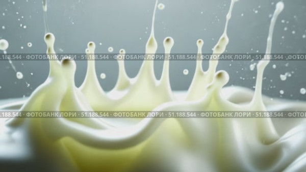 Milk splashes into the air in a stunning crown formation, symbolizing freshness and purity. This high-speed image of dairy splash is ideal for visualizing themes around Shrovetide (Maslenitsa) in Russia, when dairy products play a cultural role. Perfect for articles or ads highlighting healthy nutrition, Orthodox food traditions, or recipes related to festive pancake week. Стоковое AI-видео, аниматор Ксения Чунаева / Фотобанк Лори