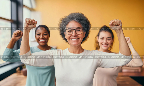 Mixed race women with raised fists of empowerment, strength and women solidarity, International Womens Day concept. Стоковое AI-изображение, AI-художник Анастасия Золотницкая / Фотобанк Лори
