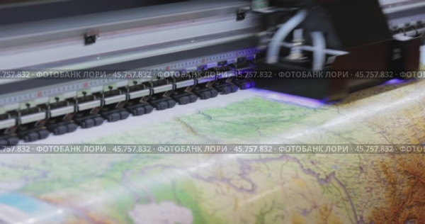 Modern Digital Large format UV printer. Printing production technologies. UV pinning is the process of applying a dose of low intensity ultraviolet light to a UV curable ink. Стоковое видео, видеограф Андрей Армягов / Фотобанк Лори