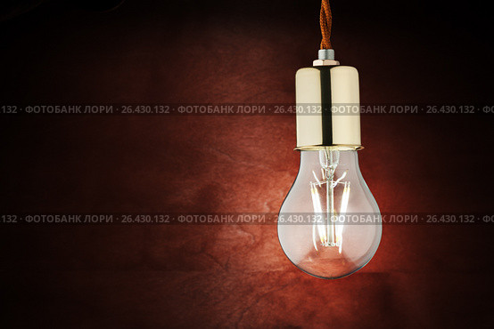 Modern economical LED lighting. LED lamp on a wooden table. Стоковое фото, фотограф Alexander / Фотобанк Лори