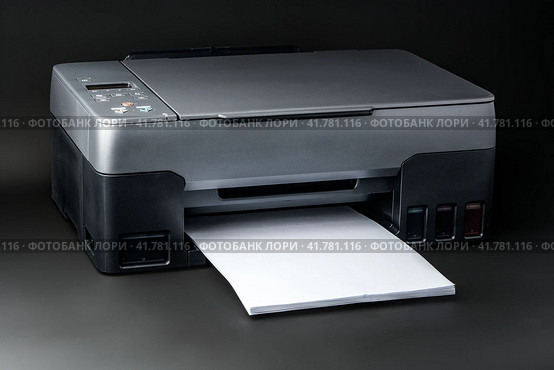 Modern laser printer on black background close up. Стоковое фото, фотограф Сергей Толмачёв / Фотобанк Лори
