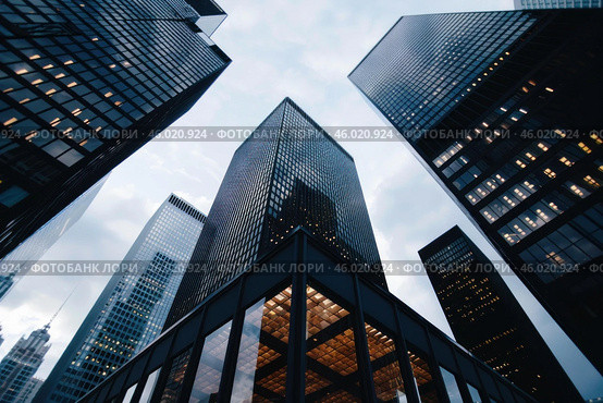 Modern skyscrapers reaching for the sky in a bustling city center. Стоковое AI-изображение, AI-художник Иван Рябоконь / Фотобанк Лори