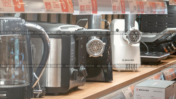 Moscow February 09 2025, Row of kitchen appliances including a grater and a toaster. Редакционное фото, фотограф Скрипачев Антон / Фотобанк Лори