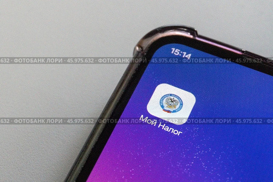 Moscow, Russia - January 19, 2025: Moy nalog app icon on smartphone screen with russian text. Редакционное фото, фотограф Zakharova Natasha / Фотобанк Лори