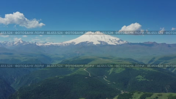 Mount Elbrus and hills Caucasus mountains. Стоковое видео, видеограф Михаил Коханчиков / Фотобанк Лори
