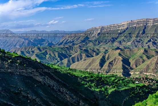 Mountain landscape with a huge geological fault, a vast valley in Dagestan, the villages of Chokh and Gunib and abandoned farm Kurib are visible. Стоковое фото, фотограф Евгений Харитонов / Фотобанк Лори