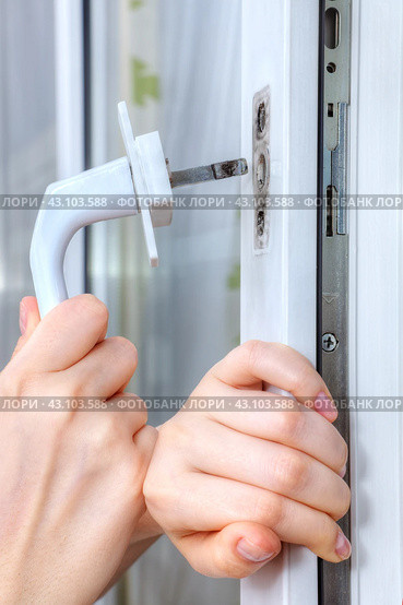 Mounting handle on double hung window with double-glazed. Стоковое фото, фотограф Владимир Григорьев / Фотобанк Лори