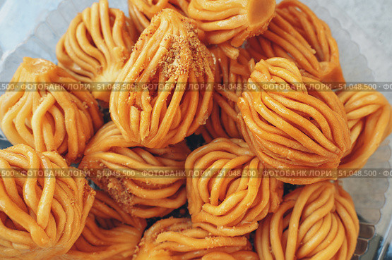 Muslim holiday sweets Moroccan chebakia chak chak and handmade nath Homemade Muslim sweet baked goods. Close-up. Стоковое фото, фотограф Оксана Медведева / Фотобанк Лори