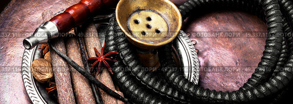 Nargile with spices. Smoking shisha in east style with tobacco aroma of spices. Стоковое фото, агентство Ingram Publishing / Фотобанк Лори