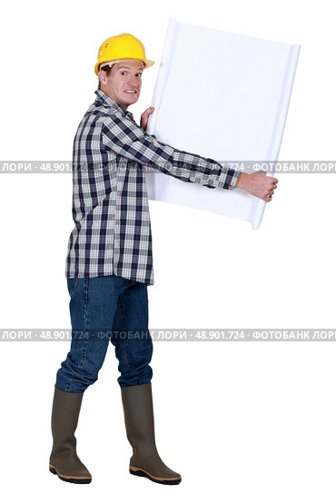 Nervous foreman holding plans. Стоковое фото, агентство Ingram Publishing / Фотобанк Лори